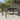 Tuintafel 150x90x75 cm gehard glas en poly rattan bruin