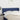 Hoofdbord met randen 147x23x78/88 cm stof blauw
